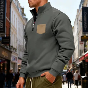Detailed view of men's heavy fleece half-zip sweatshirt with khaki chest pocket