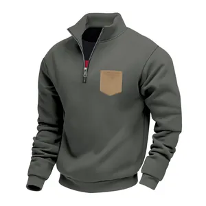 Detailed view of men's olive heavy fleece sweatshirt with tan chest pocket and zipper.