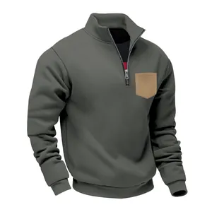 Close-up front view of heavy gray fleece sweatshirt with half-zip and tan pocket.