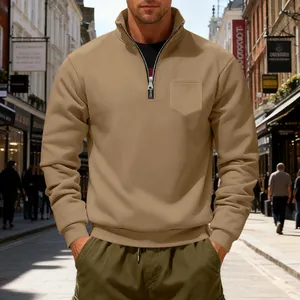 Detail of men's khaki heavy fleece sweatshirt with quarter-zip collar and chest pocket