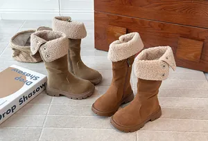 Close-up of girls winter high boots featuring soft fleece lining and fold-over cuffs