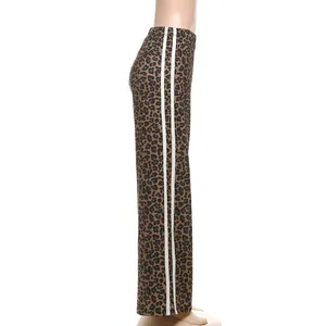 Side view of leopard print wide-leg pants with white side stripes and high waist.