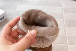 Detail of the thick fleece lining in these warm girls' winter tall boots