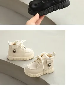 Detailed close-up of cream toddler winter boots featuring warm plush lining and thick soles