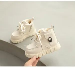 Close-up detail of children's beige fleece-lined winter Martin boots with side zipper