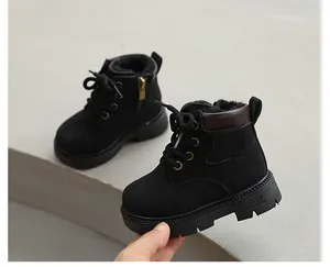 Close-up of black children's winter Martin boots with warm plush lining