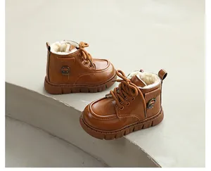 Detailed view of warm brown children's Martin boots featuring thick fleece lining.