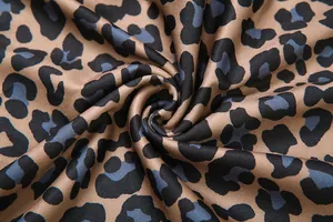 Detailed macro view of high-quality leopard print fabric texture for fashion pants