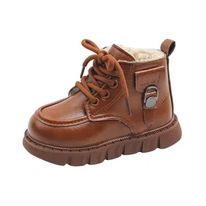 Brown faux leather children's Martin boot with warm faux fur lining and buckle detail.