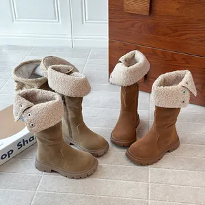 Warm fleece-lined tall boots for girls, featuring stylish sherpa fold-over tops and brown suede.