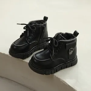 Waterproof black winter Martin boots for children featuring warm faux fur lining