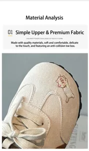 Macro detail showing the soft beige fabric and cute embroidery of girl's sports shoes