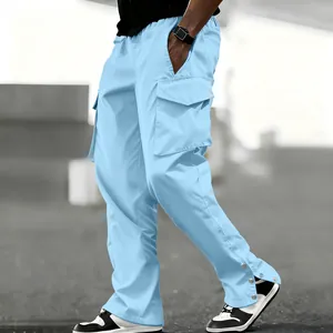 Close-up of light blue men's cargo pants featuring multiple pockets and ankle snaps.