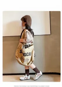 Stylish children's white and brown sneakers shown in a professional lifestyle setting