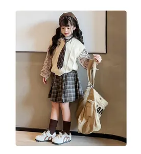 Close-up of stylish girls' German training sneakers in cream and brown