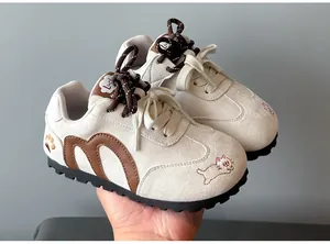 Side view of beige girls' GAT sneakers with cute cat embroidery details