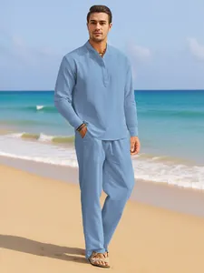 Men's light blue linen set featuring a long-sleeved shirt and trousers on the beach.
