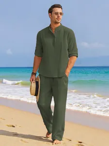 Casual men's olive green linen two-piece set featuring stand collar shirt on sunny beach