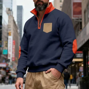 Detail view of men's quarter-zip fleece sweatshirt with orange collar and elbow patches