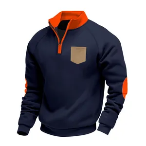 Close-up of navy blue men's quarter-zip sweatshirt with orange trim details.