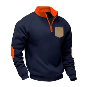Detail of navy sweatshirt with orange stand collar, elbow patches and tan pocket