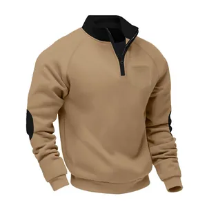 Detail of men's khaki heavy fleece pullover with black half-zip and elbow patches.