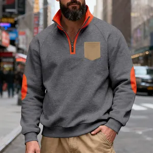Detailed view of men's heavyweight fleece sweatshirt with orange accents and stand collar