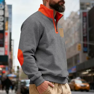 Close-up of men's heavyweight fleece sweatshirt with orange collar and elbow patch.