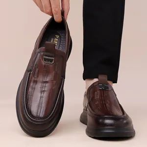 Classic premium brown leather loafers with thick soles for elegant business wear.