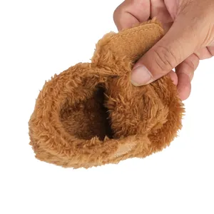 Close-up of brown fuzzy baby walking shoes with soft plush lining and velcro strap