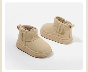 Close-up of quilted beige toddler boots with warm fleece lining and side zipper.