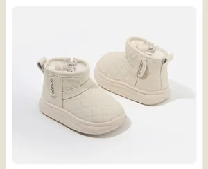 Side view of cream toddler winter boots with quilted pattern and warm fleece lining.
