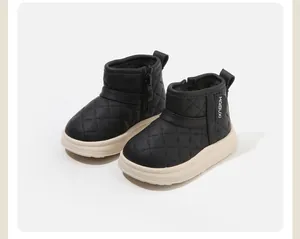 Detail view of quilted black toddler winter boots with warm lining and thick sole