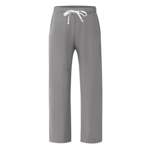 Vue de face d'un pantalon décontracté en lin gris pour homme avec cordon blanc à la taille