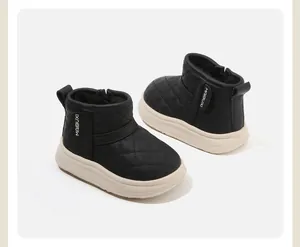 Detailed side view of black quilted winter boots for toddlers with thick soles.