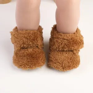 Detail view of cozy brown fluffy baby walker booties for 0-1 year old infants