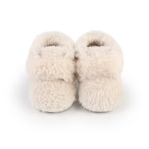 Close-up of soft plush baby walking shoes in cream white for 0-1 year olds