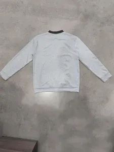 Back view of a casual gray men's jacket with a contrasting stand collar design
