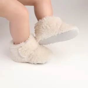 Soft fuzzy baby walker shoes with non-slip soles for cozy infant steps, age 0-1