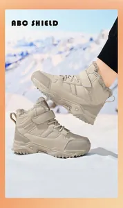 Detail of the warm faux fur lining and rugged non-slip sole on beige children's winter boots