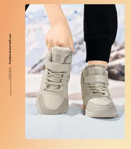 Warm boys' snow boots with thick fur lining and anti-slip sole in snow scene