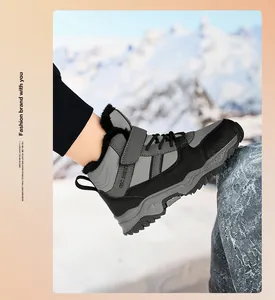 Detail view of thickened boys' snow boot with warm fur lining and gray-black design