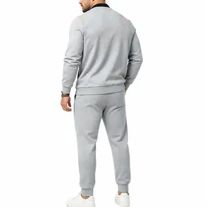 Back view of men's grey casual tracksuit sweatshirt and jogger pants set for autumn