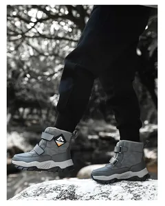 Detailed view of grey children's winter snow boots featuring warm lining and Velcro straps
