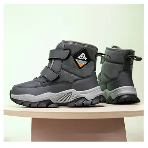Detailed view of grey children's snow boots with dual velcro straps and anti-slip sole.