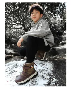 Durable boys' brown snow boots with velcro straps and anti-slip soles for winter