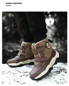 Detailed view of children's warm brown snow boots featuring secure double velcro straps
