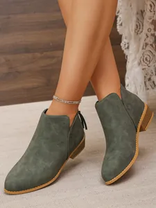 Olive green pointed toe ankle boots with chunky heel and tassel zipper detail