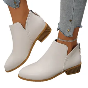Elegant white pointed toe ankle boots with low block heel and back zipper closure