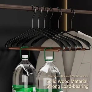 Solid wood and metal coat hanger with wide shoulders and heavy-duty load-bearing.